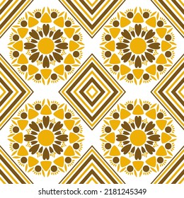 Seamless pattern with yellow and brown diamond shapes and flower shapes drawn from mixed shapes.