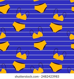 Seamless pattern with yellow cartoon swimsuit on bright blue background. Vector summer pattern