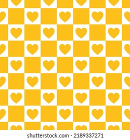 Seamless pattern with yellow checkerboard and hearts.