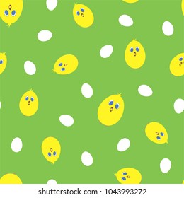 Seamless pattern with yellow chickens and eggs on a green background. Vector.