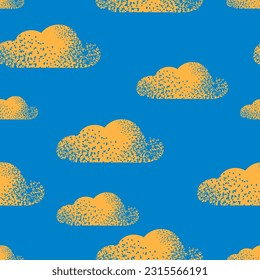 Seamless pattern with yellow clouds on a blue background for printing on fabrics, textiles. Vector.