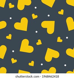 Seamless pattern with yellow hearts on a dark background. 