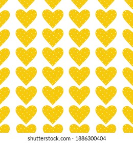 Seamless pattern of yellow hearts with polka dots. Fashionable print for textiles, bed linen, wrapping paper, holiday cards, notebooks. Vector illustration.