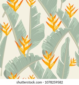 Seamless pattern yellow heliconia flower on banana leaf tropical leaves background.printing wallpaper.vector illustration