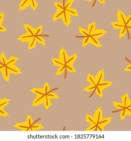 Seamless pattern with yellow maple leaves. Brown stem. Beige background. Autumn or summer. Nature or ecology. Doodle cartoon style. For postcards, wrapping paper textile, wallpaper and scrapbooking