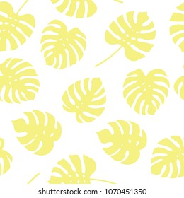 Seamless pattern of yellow monstera leaves. Tropical leaves of palm tree background