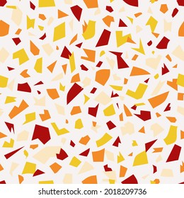Seamless pattern with yellow and orange terrazzo design.