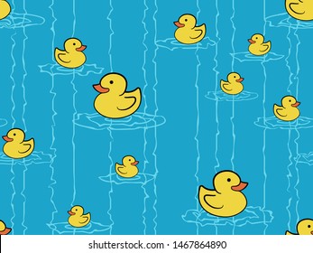 Seamless pattern of yellow rubber ducks on a blue background