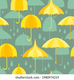 Seamless pattern with yellow umbrellas and teal umbrellas and rain drops. Dark teal background. Design element for web and print usage.