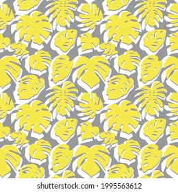 Seamless pattern with yellow and white tropical leaves on gray background. Monstera leaves silhouette pattern.