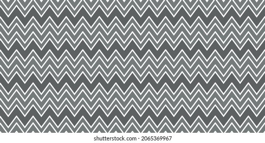 seamless pattern with zigzag lines forming geometric ornament in gray colors. chevron pattern