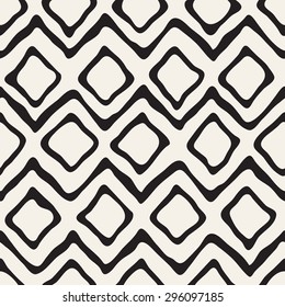 Seamless pattern with zigzag and rhombuses. Repeating vector texture. Stylish tribal background. Modern graphic design.