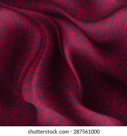 Seamless patterned dark red fabric with a floral pattern in the form of vines