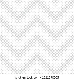 Seamless pattern.Infinitely repeating stylish modern texture consisting of dots of the different size which form geometrcial zigzag dotted shapes with halftone effect. Gradation from bigger to smaller