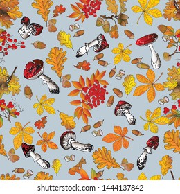 Seamless patterns in the form of autumn leaves of oak, chestnut, rowan and red mushrooms on a pale blue background.
				