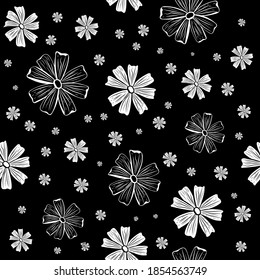 Seamless patterns. Large and small chamomile flowers on a black background. Contrast endless vector illustration.