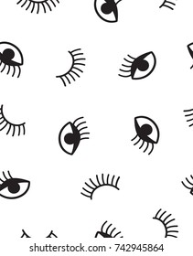 Seamless patterns with winking eyes and eyelashes. In black and white.