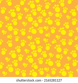seamless paw prints. white background. cute yellow animal tracks on a yellow background. vector texture. fashionable print for textiles, wallpaper and packaging.
