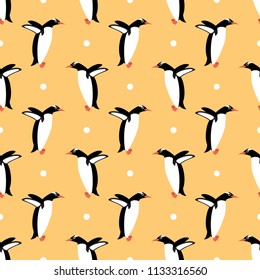 seamless penguin and polka dots vector pattern on orange background. cute animal pattern