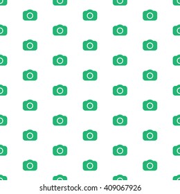 Seamless photography pattern with green cameras. Photo background template with dslr camera icons.