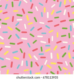 Seamless pink background with colorful sprinkles