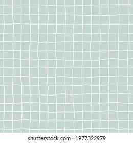 Seamless plaid pattern with white hand drawn doodle lines on a blue background. Abstract boho texture in retro style for wrapping paper, covers and fabric.