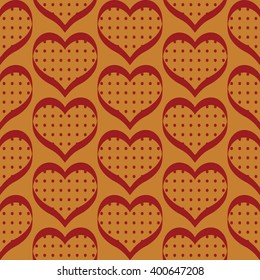 Seamless polka dot hearts pattern background for use in the textile printing and design packages