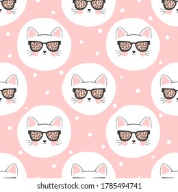 Seamless polka dot pattern with cute cats. Baby print, kids textile.	