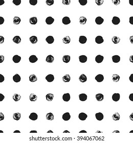 Seamless polka dot pattern. Dry brush painted circles with rough edges. Trendy hipster texture. Hand drawn endless stylish backdrop. Black shapes on white background. Cloth design, wallpaper, wrapping