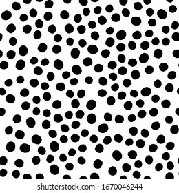 Seamless polka dot pattern hand drawn with a brush. Vector Monochrome Grunge texture of circles. Scandinavian background in a simple style for printing on textiles, paper, Wallpaper, print on t-shirts