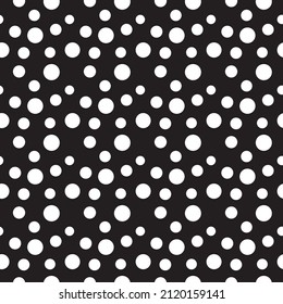 Seamless polka dot pattern. White dots on a black background. It is well suited for wrapping paper, holiday invitations, greeting cards and backgrounds.