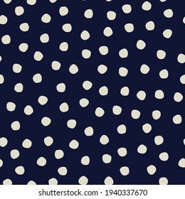 Seamless polka-dot pattern on dark blue background for surface design and other design projects
