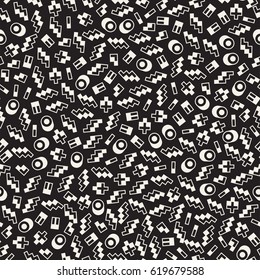 Seamless primitive jumble minimalism patterns. Randomly scattered geometric shapes. Abstract retro backgroun