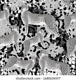 Seamless print. Vector illustration with Cheetah, Jaguar and leopard spots, flower and snake prints. Fashionable monochrome black and white wild animal ornament
