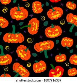  Seamless pumpkin pattern with autumn fallen leaves on a black background. Autumn Halloween pattern.Design for Halloween and thanksgiving, textiles, paper, printing