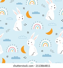 seamless rabbit pattern nursery with the sky and rainbow on blue background for print, wallpaper, textile, vector illustration