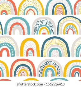 Seamless rainbow pattern. Childish colorful hand-drawn background. Trendy illustration in Scandinavian style. Ideal for printing fabric, textile, wrapping paper.