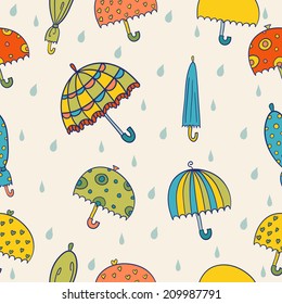 Seamless rainy pattern with color umbrellas. Seamless pattern can be used for background, card template, business card or for website. Hand drawn umbrellas pattern made in vector.