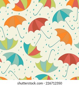 seamless rainy pattern with umbrellas and raindrops