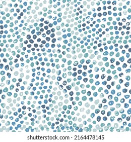 Seamless random blue dot background pattern. Abstract colorful polka dots textured pattern on white background.