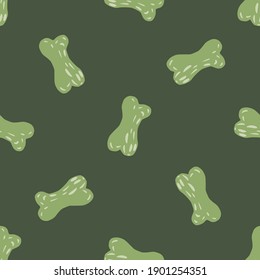 Seamless random pattern with hand drawn green bones silhouettes print. Pale olive background. Stock illustration. Vector design for textile, fabric, giftwrap, wallpapers.