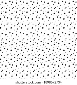 Seamless random small black polka pattern on white background. Irregular chaotic points. Vector graphic. Abstract scattered dots wallpaper. Simple, modern decorative print on wrapping paper, fabric