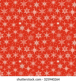 Seamless red pattern with snowflakes. Can be used for wallpaper, pattern fills, textile, web page background, surface textures