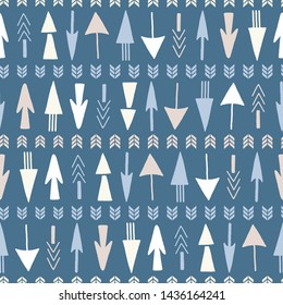 Seamless repeat of hand drawn arrows on a blue background. A geometric vector design.