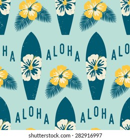 Seamless repeat pattern with blue surf boards and yellow hibiscus flowers on a light blue background.