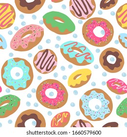 Seamless repeat pattern with colourful colorful donuts or doughnuts with sprinkles and icing tossed on a white background with scribbled drawn sketched blue dots	