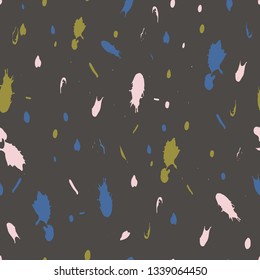 Seamless repeat pattern design, vector illustration of dots and spatters drawn in shades of bright yellow, olive, blue, black, turquiose, pink and white.
