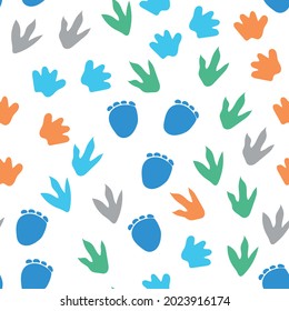 Seamless repeat pattern with different shape colorful dinosaur foot prints tracks on a white background. Great for boys and kids designs