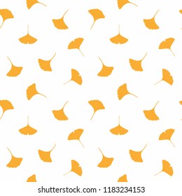 Seamless repeat pattern with falling ginkgo leaves, on a white background. Hand drawn vector illustration. Flat style design. Concept for autumn textile print, wallpaper, wrapping paper.