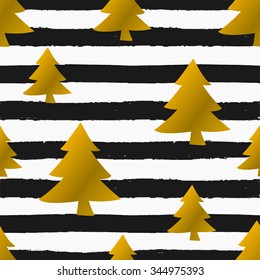 Seamless repeat pattern with gold foil Christmas trees on black and white striped background. Tiling festive background, greeting card or wrapping paper.